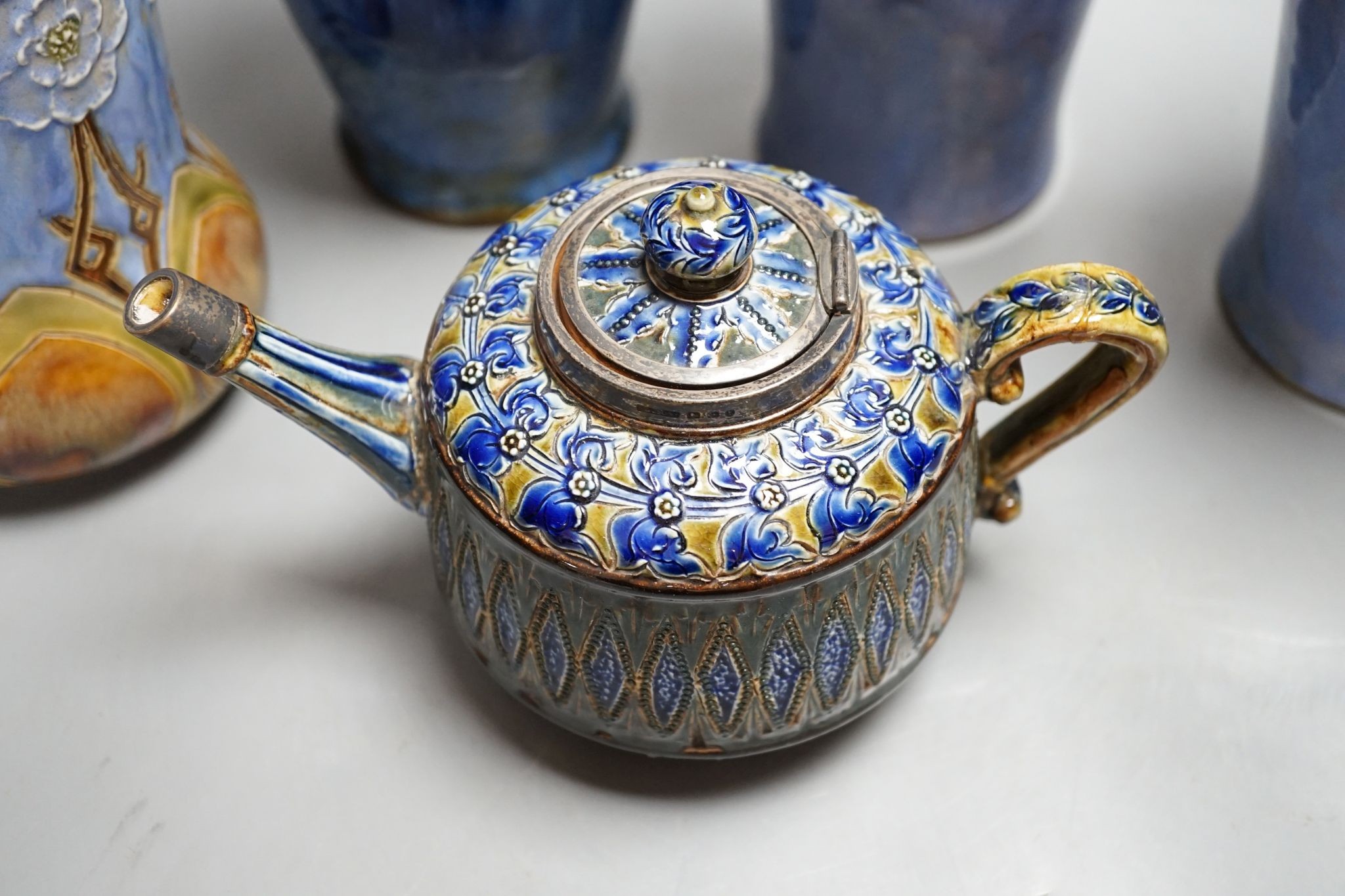 A Doulton teapot and four Doulton vases, 26cm